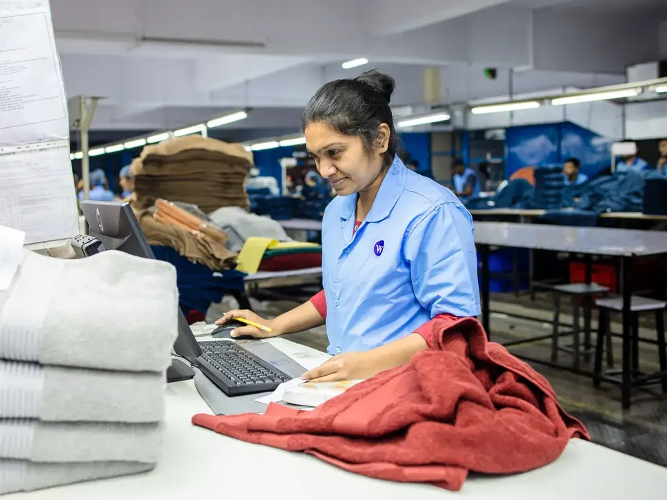 Worker checking textiles in a Chinese factory