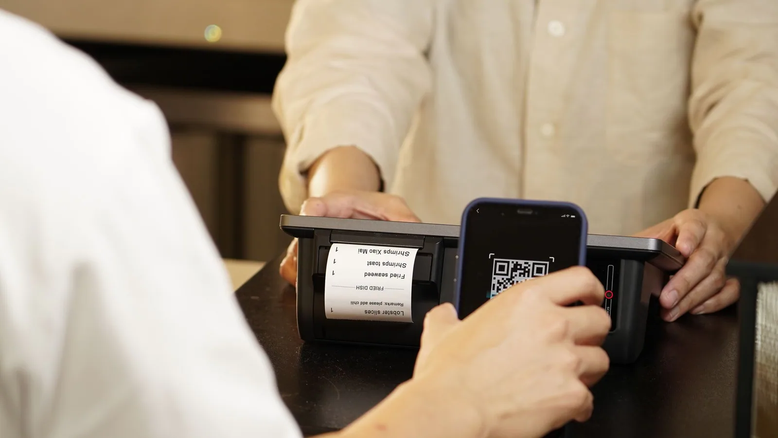 Traveller scanning a QR code to make a mobile payment in China