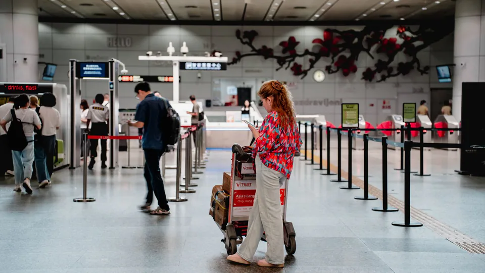 International business traveller arriving at Guangzhou airport with local support