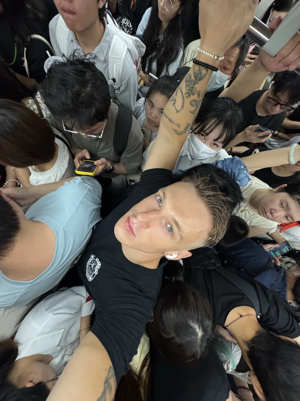 Passengers using a busy metro system in China